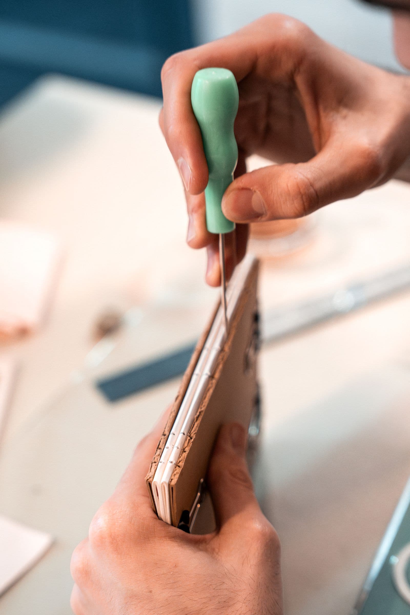 A text block being sewn during binding